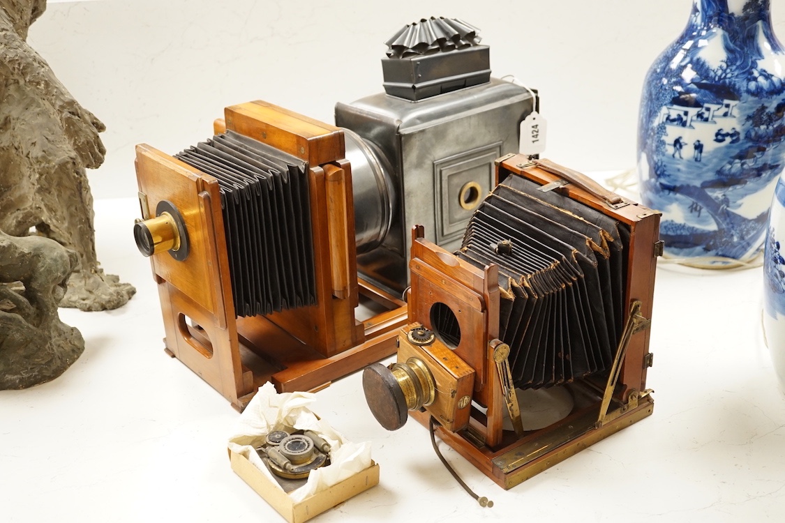 An early 20th magic lantern and a bellows camera, Magic lantern 51 cms wide.